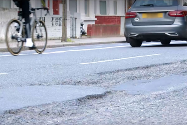 Pledge to deal with more potholes like this one on Garratt Lane